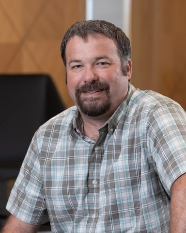 portrait of a smiling person in professional attire